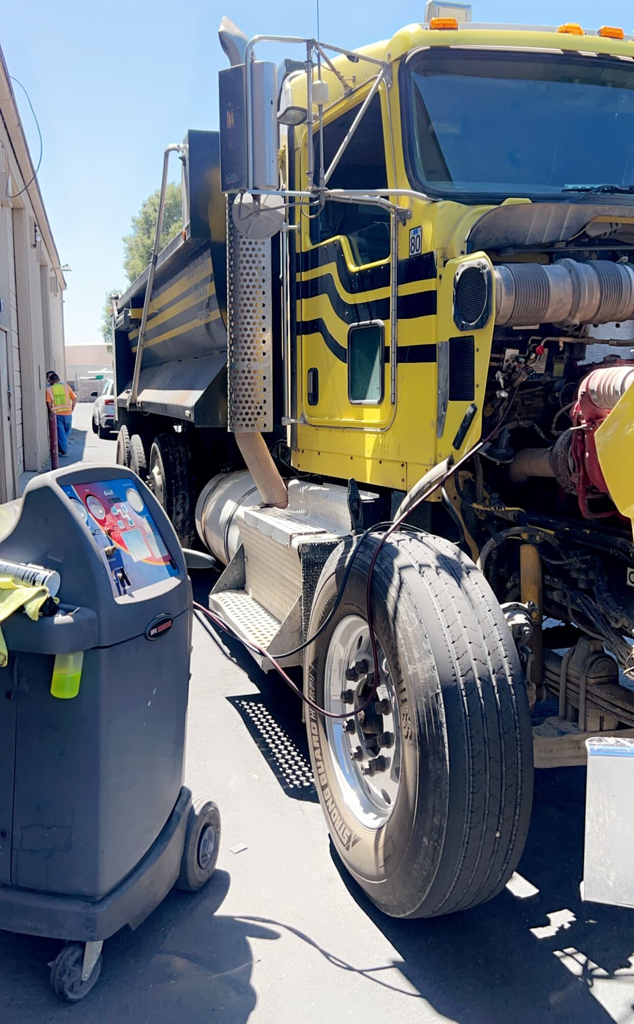 Yellow dump truck in shop